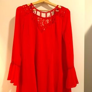 Red mid-length flowy dress with cutout neckline